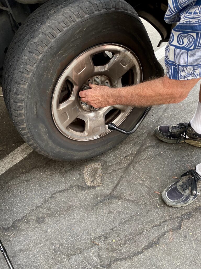 Mobile Truck Repair - Man Replacing Flat Tire with Spare Tire