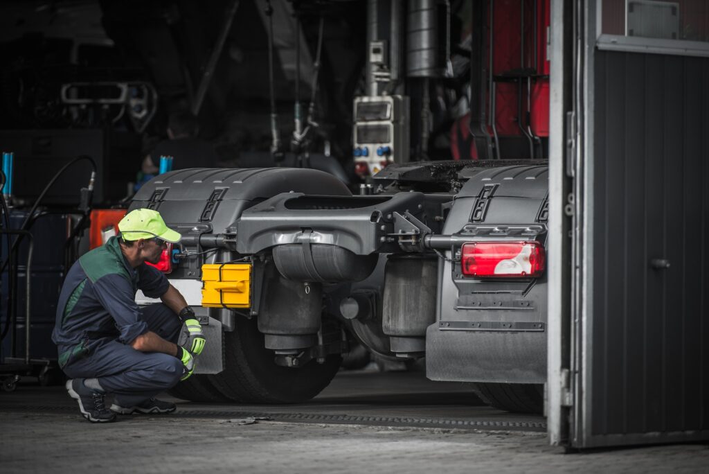 Mobile Truck Repair - Technician Servicing a Truck"